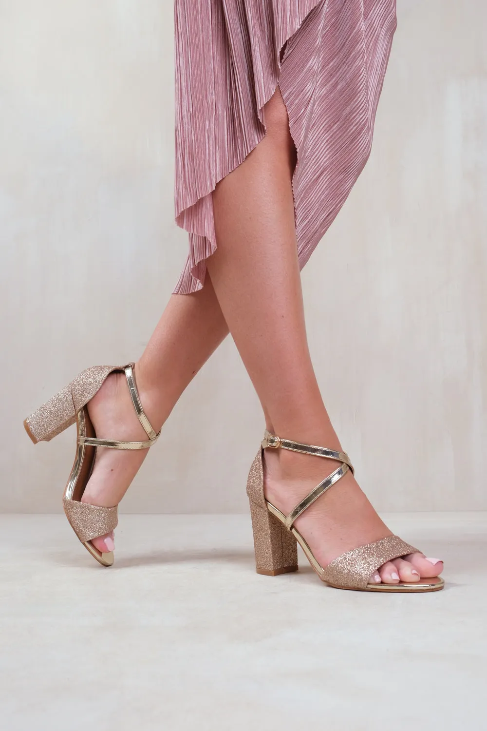 RUTH MID HIGH BLOCK HEEL SANDALS WITH CROSS OVER ANKLE STRAP IN GOLD